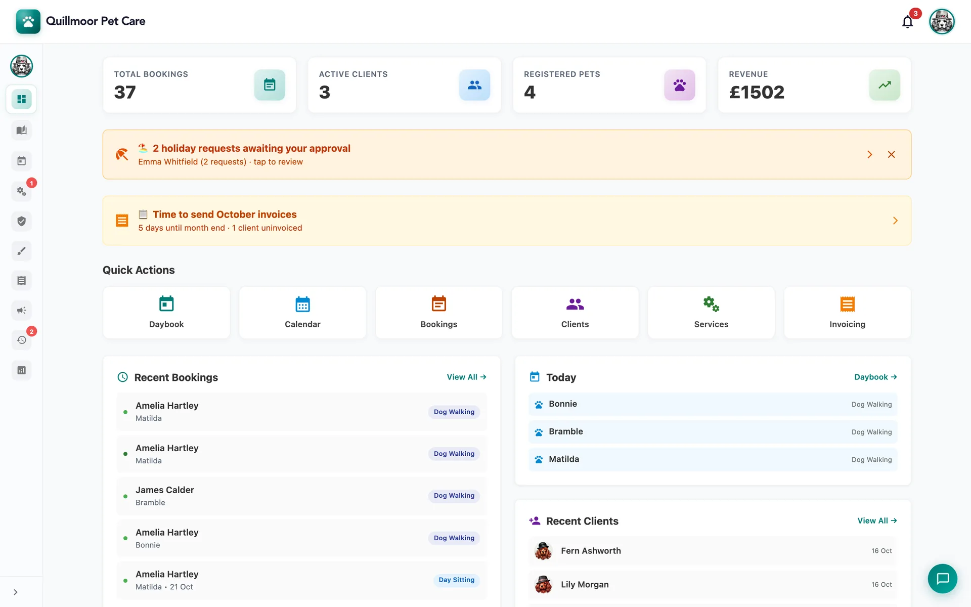 MyPetSitter admin dashboard for the test business Quillmoor Pet Care, with the menu folded to icons: cards reading 37 total bookings, 3 active clients, 4 registered pets and £1502 revenue, a banner for 2 holiday requests awaiting approval and a reminder that it is time to send October invoices, quick-action tiles for Daybook, Calendar, Bookings, Clients, Services and Invoicing, recent bookings for Amelia Hartley and James Calder, today’s walks for Bramble, Bonnie and Matilda, and recent clients.
